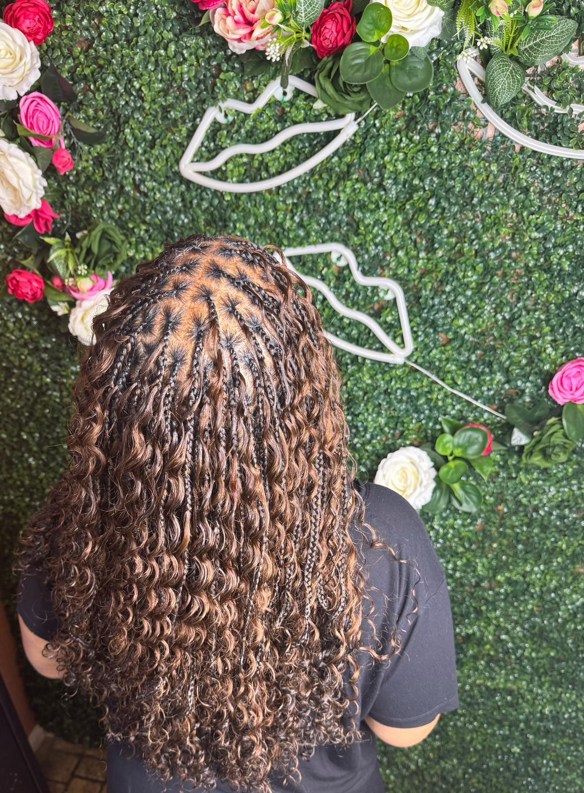 Boho braids with auburn highlights at Braids by estal