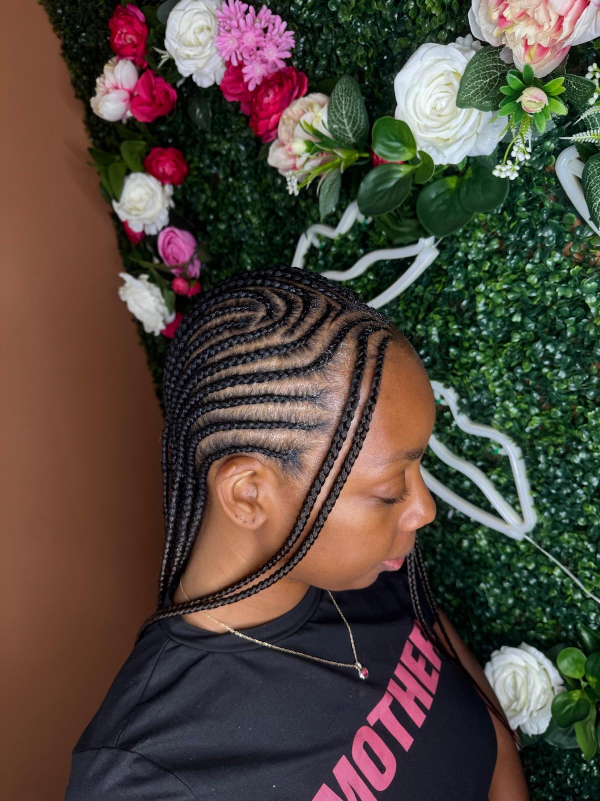 Side-swept cornrows at Braids by estal