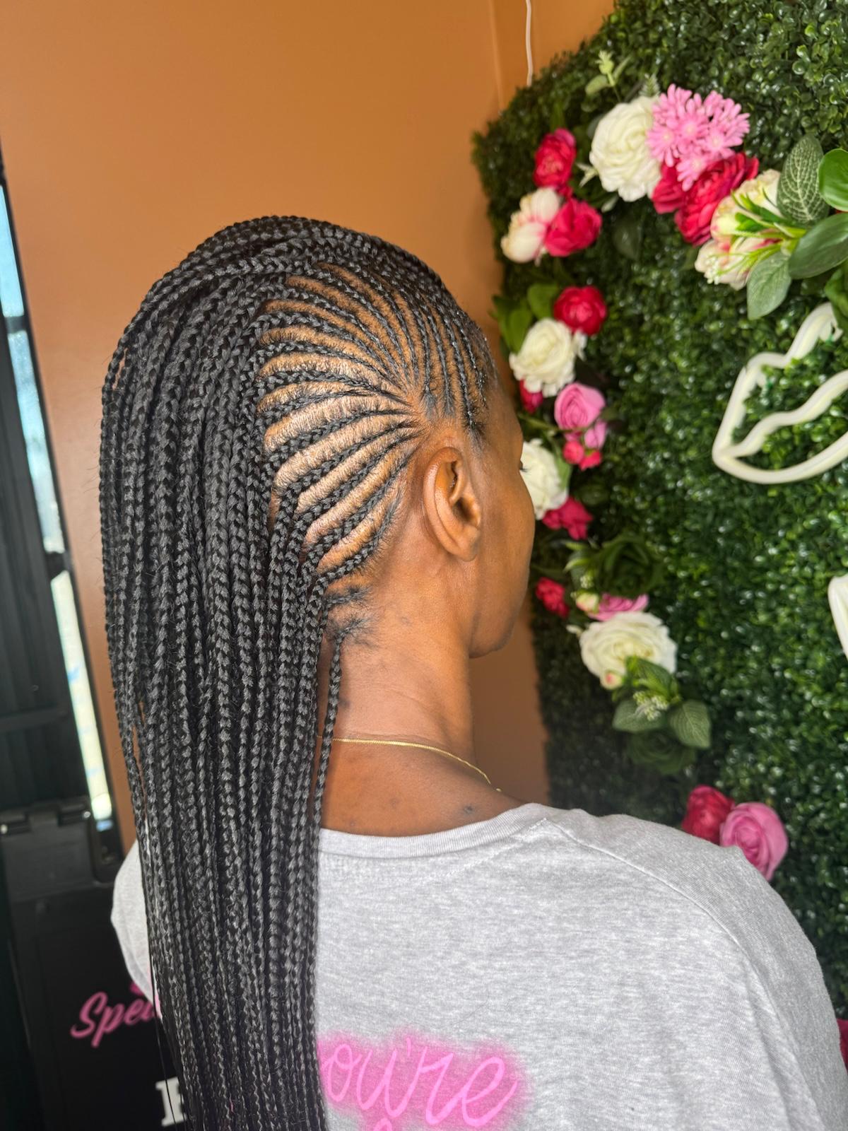 Side-swept lemonade braids at Braids by estal